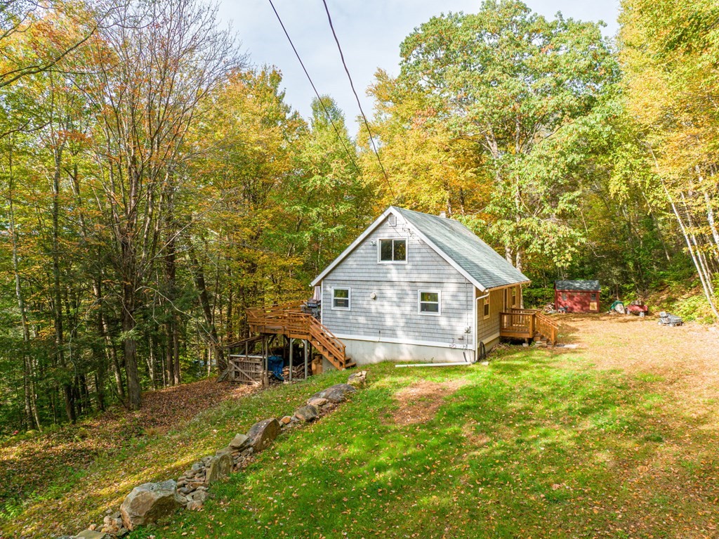 19 Broderick Road Monterey, MA 01245 - Photo 3 of 15 a view of a big house with a big yard and large trees
