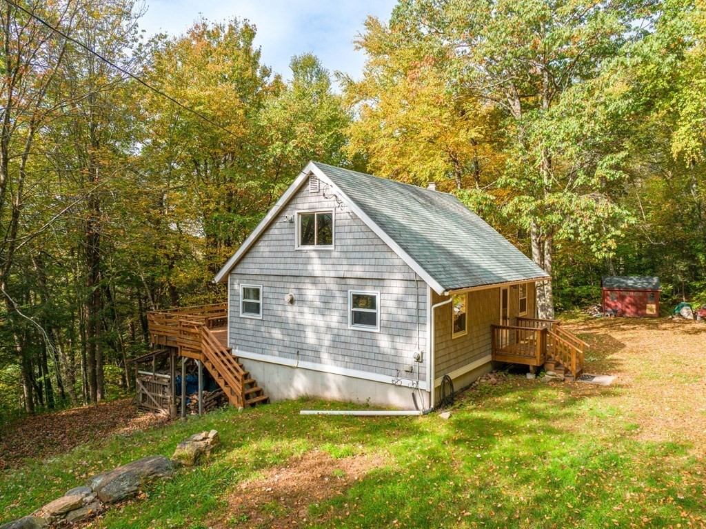 19 Broderick Road Monterey, MA 01245 - Photo 5 of 15 a view of a house with a yard and sitting area