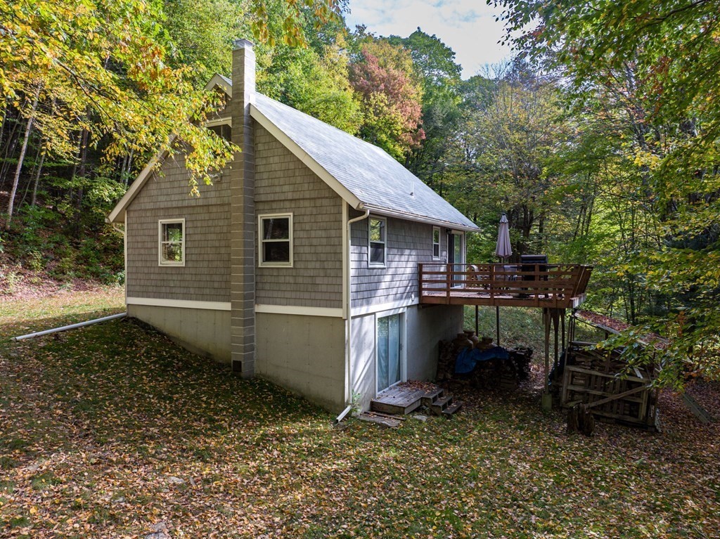 19 Broderick Road Monterey, MA 01245 - Photo 7 of 15 a backyard of a house with table and chairs