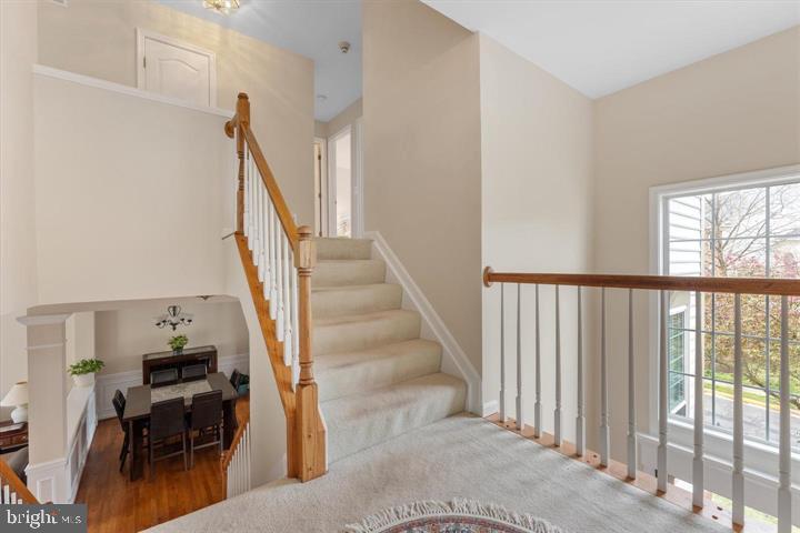 20900 Trinity Square Sterling, VA 20165 - Photo 18 of 38 a view of entryway and hall with wooden floor