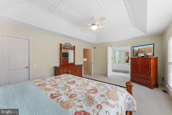 20900 Trinity Square Sterling, VA 20165 - Photo 21 of 38 a bedroom with a large bed and dresser