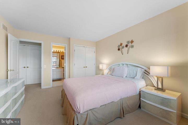 20900 Trinity Square Sterling, VA 20165 - Photo 26 of 38 a bedroom with a bed and a table