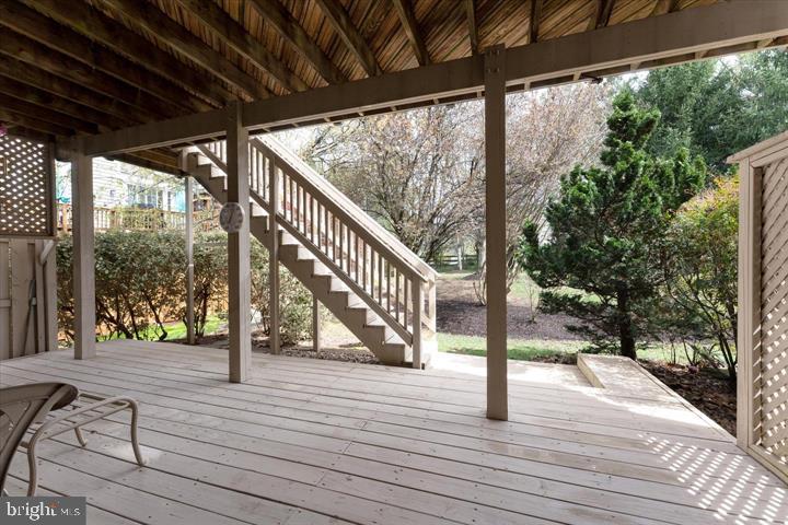 20900 Trinity Square Sterling, VA 20165 - Photo 34 of 38 a view of trees and deck with wooden floor and fence