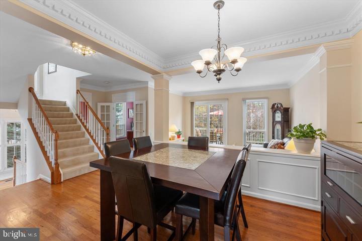 20900 Trinity Square Sterling, VA 20165 - Photo 5 of 38 a view of a dining room with furniture window and wooden floor