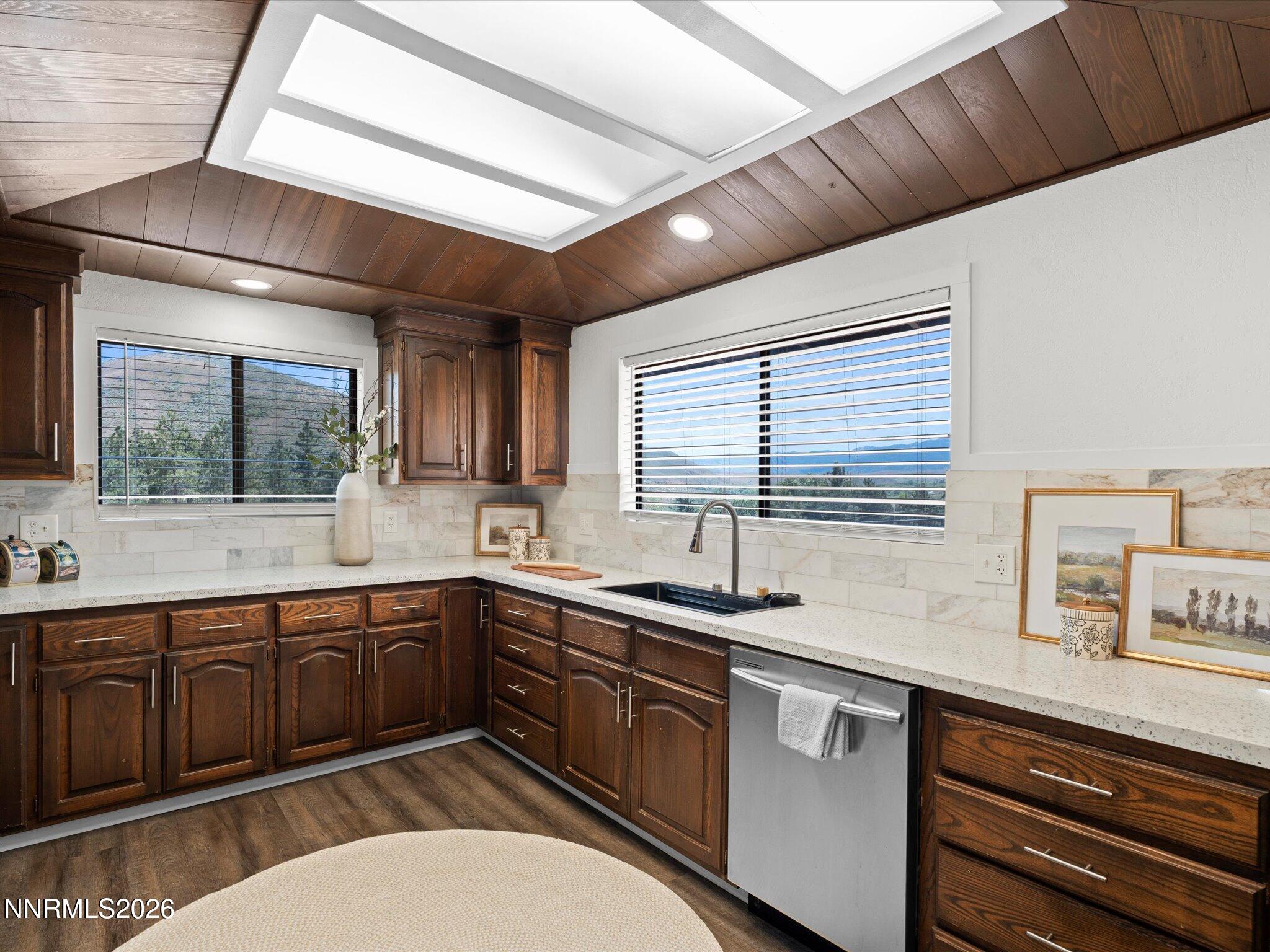 20449 Temelec Way Reno, NV 89521 - Photo 23 of 65 a kitchen with a sink stove and cabinets