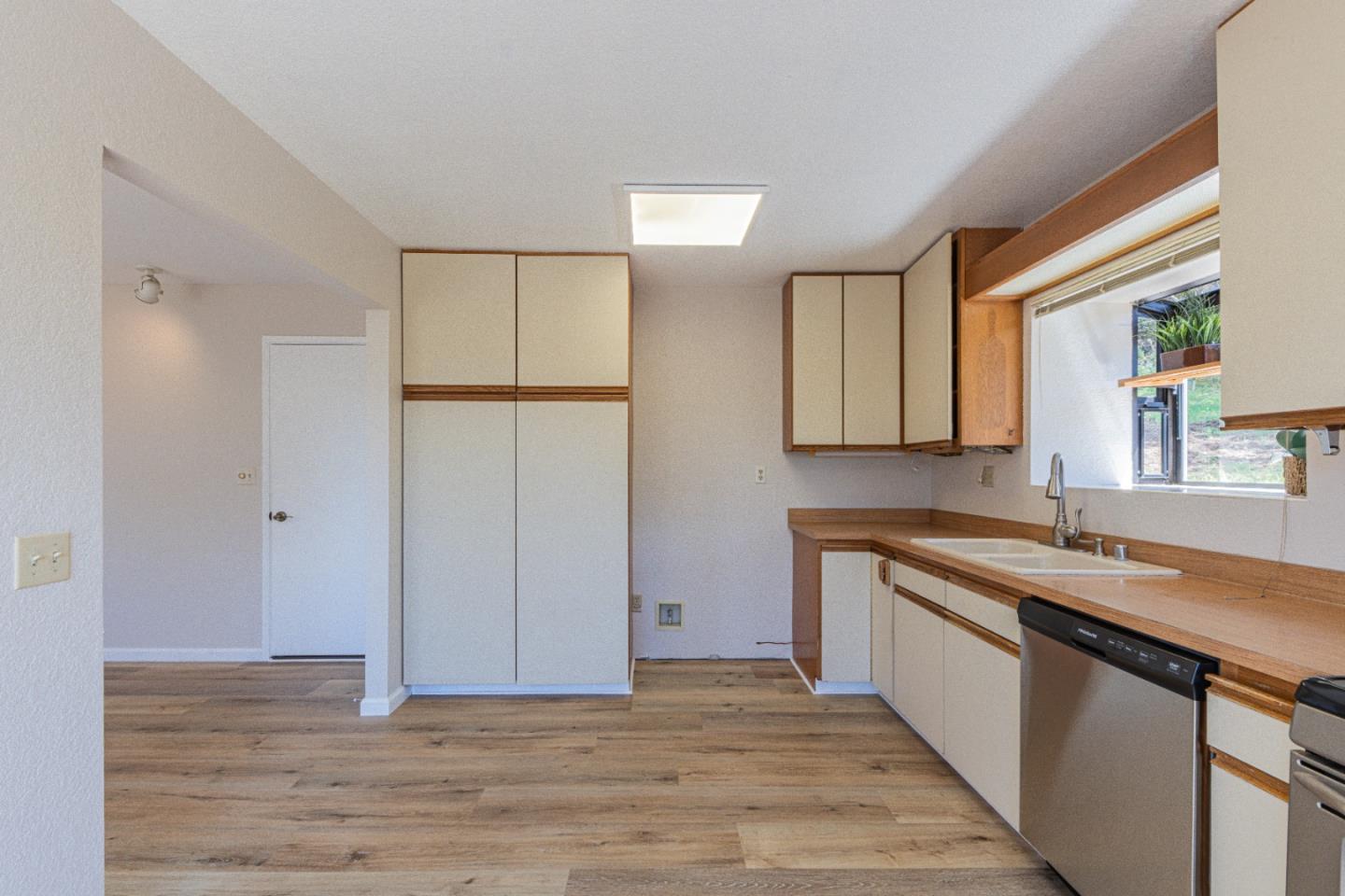 6959 Valle Pacifico Road Salinas, CA 93907 - Photo 17 of 45 a kitchen with a sink cabinets and a window