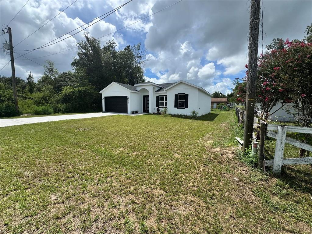 5394 Northwest 6th Place Ocala, FL 34482 - Photo 2 of 42 a view of a yard in front of the house