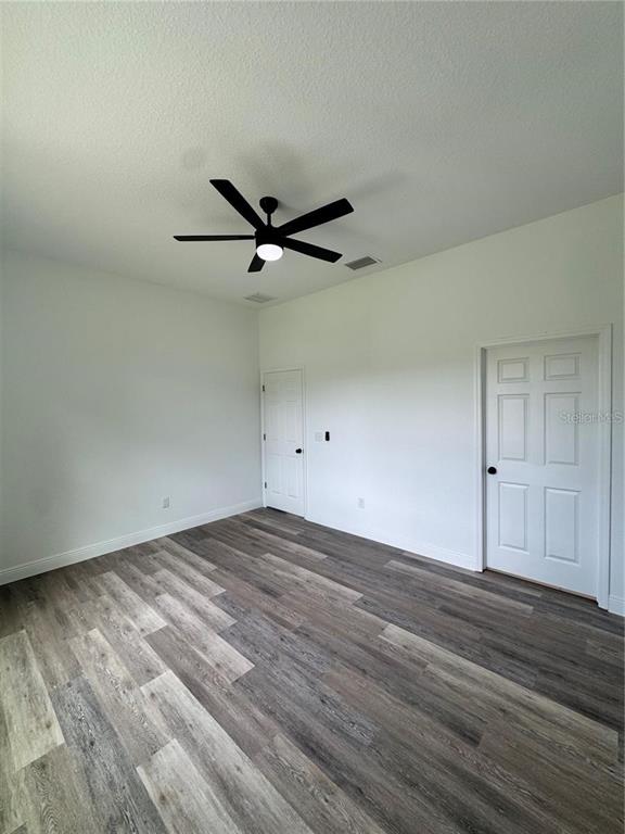 5394 Northwest 6th Place Ocala, FL 34482 - Photo 24 of 42 wooden floor in an empty room