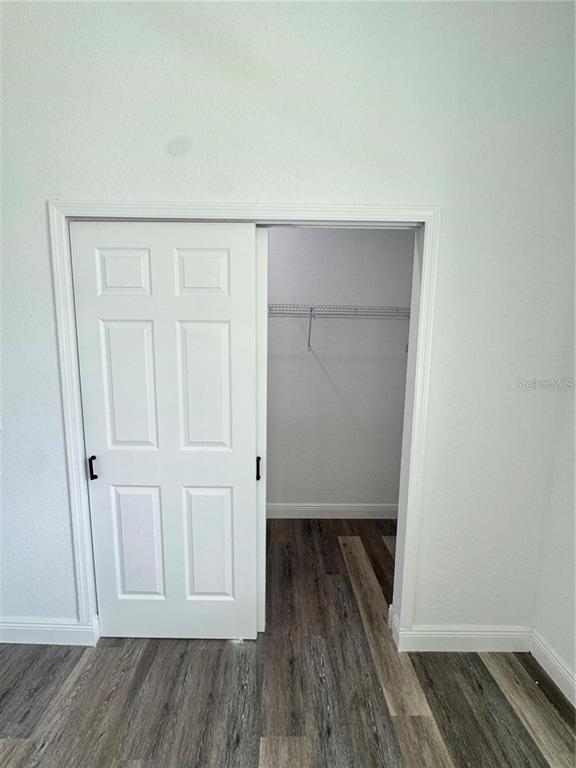 5394 Northwest 6th Place Ocala, FL 34482 - Photo 28 of 42 an empty room with wooden floor