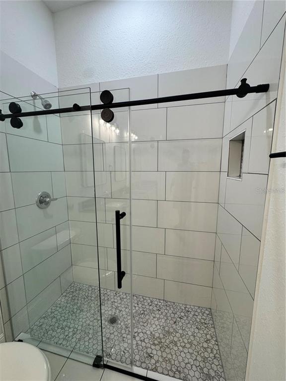 5394 Northwest 6th Place Ocala, FL 34482 - Photo 34 of 42 a bathroom with a shower