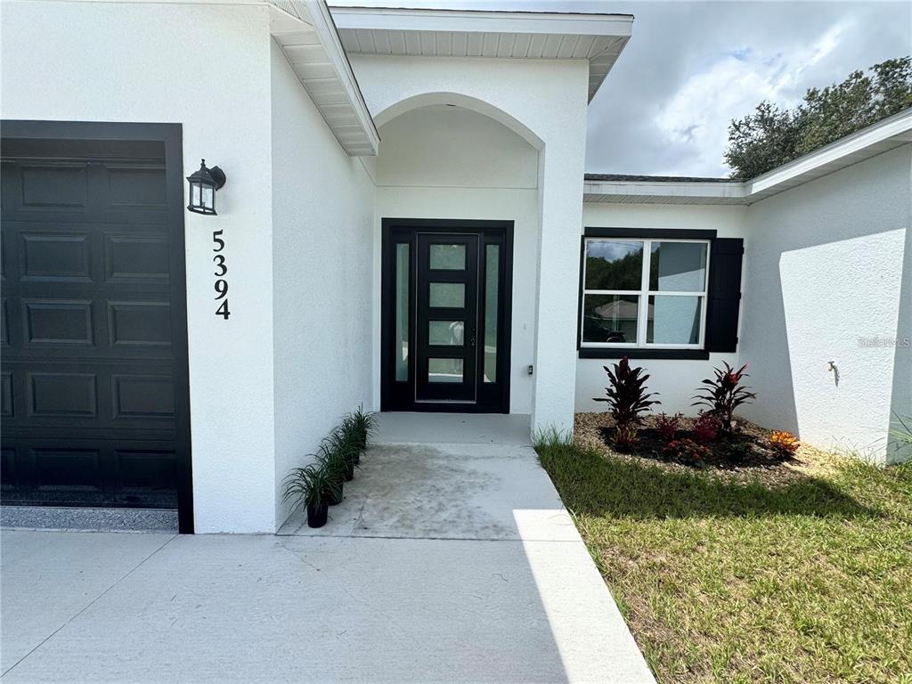 5394 Northwest 6th Place Ocala, FL 34482 - Photo 4 of 42 a front view of a house