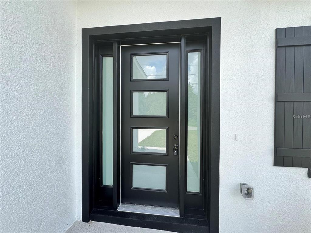 5394 Northwest 6th Place Ocala, FL 34482 - Photo 5 of 42 a view of a wooden door