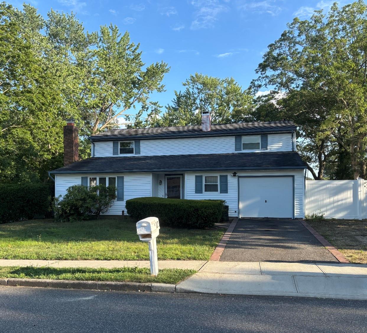 12 Executive Road Selden, NY 11784 - Photo 1 of 1 a front view of a house with a yard