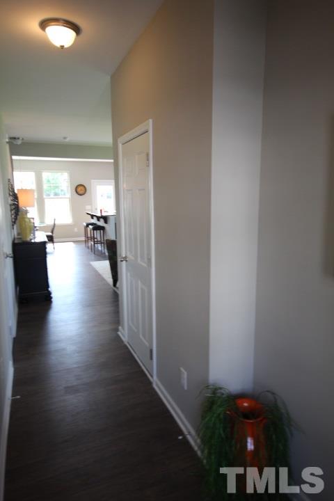 1019 Grand Ridge Drive Rolesville, NC 27571 - Photo 2 of 25 a view of a hallway with livingroom and couch