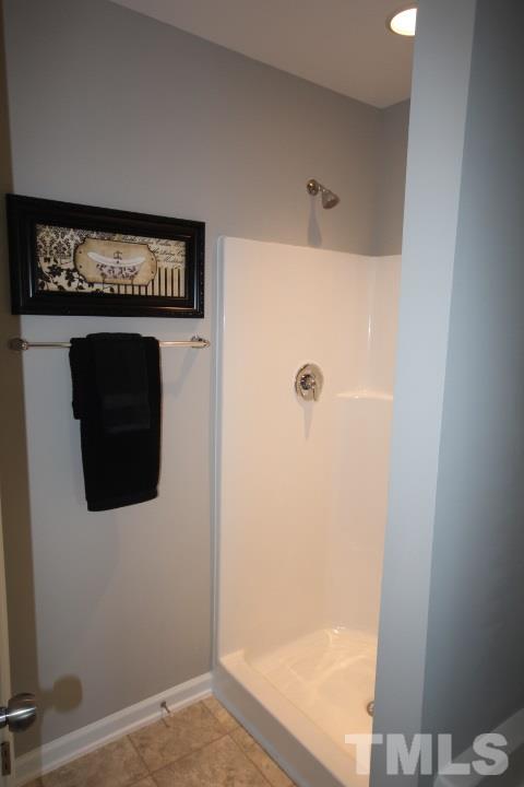 1019 Grand Ridge Drive Rolesville, NC 27571 - Photo 17 of 25 a bathroom with a shower and a sink