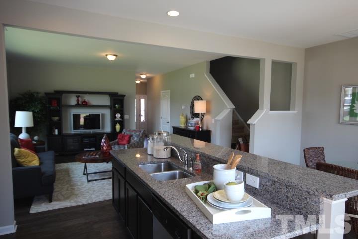 1019 Grand Ridge Drive Rolesville, NC 27571 - Photo 10 of 25 a living room with furniture and a flat screen tv