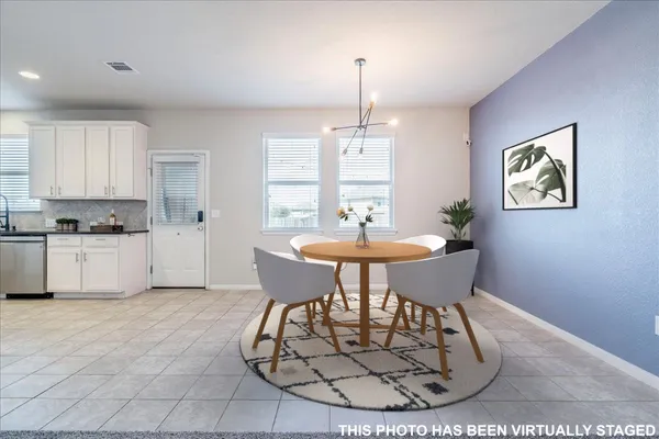 a kitchen with a white cabinets and white appliances