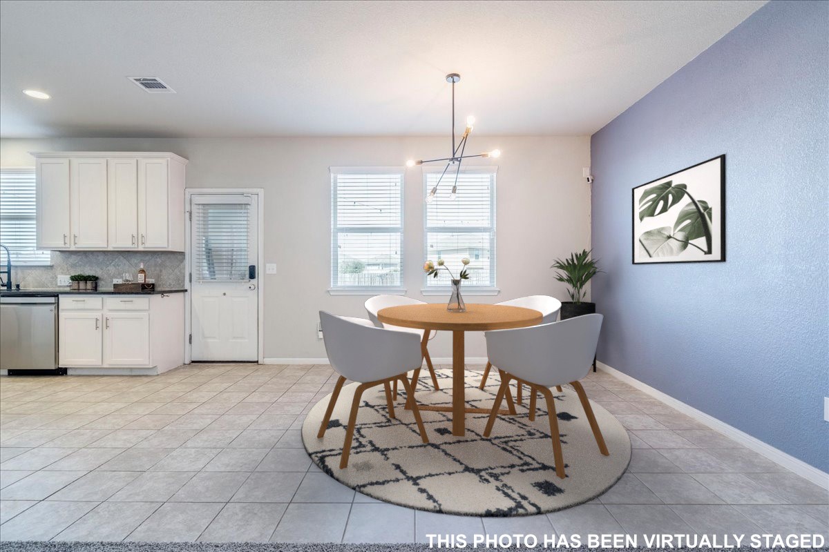312 Triumph Road Buda, TX 78610 - Photo 13 of 37 Virtually staged. Dining area is open to the living and kitchen.