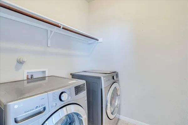 a view of a house with swimming pool and sitting area