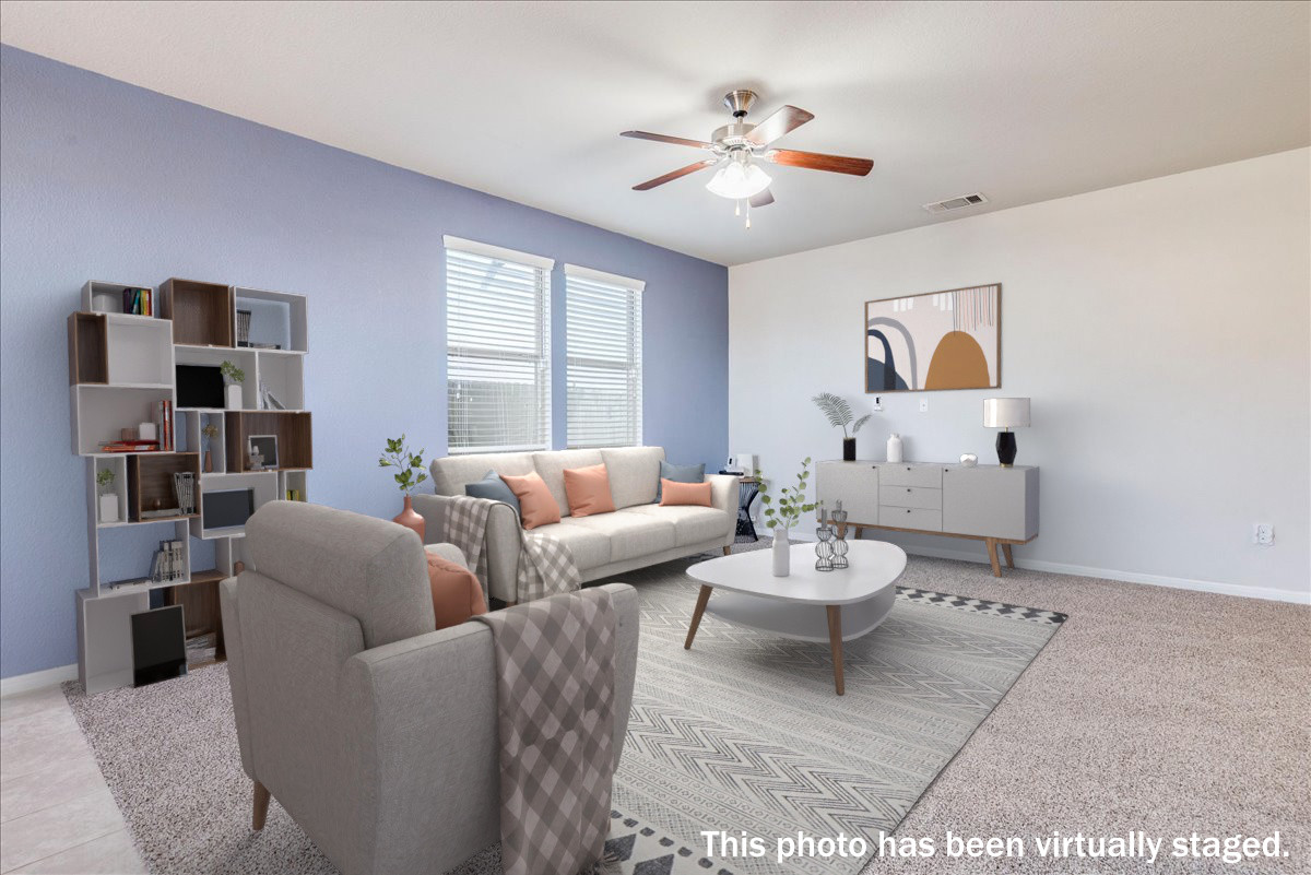 312 Triumph Road Buda, TX 78610 - Photo 9 of 37 Virtually staged. The living room is open to the kitchen and dining. Brand new carpet!!