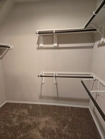 a view of a room with racks on the wall