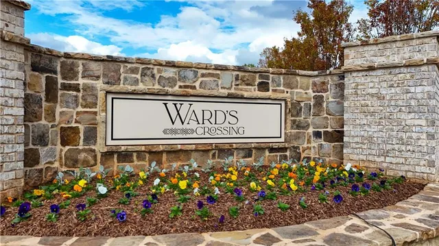 a view of backyard with plants and lake view