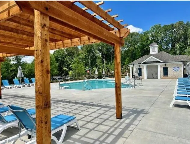 a view of a backyard with a patio and mountain view