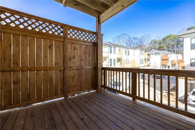 a view of a balcony with wooden floor