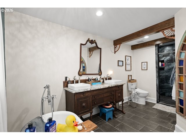 526 East Punkin Center Road Hermiston, OR 97838 - Photo 17 of 48 a bathroom with a sink mirror vanity and toilet