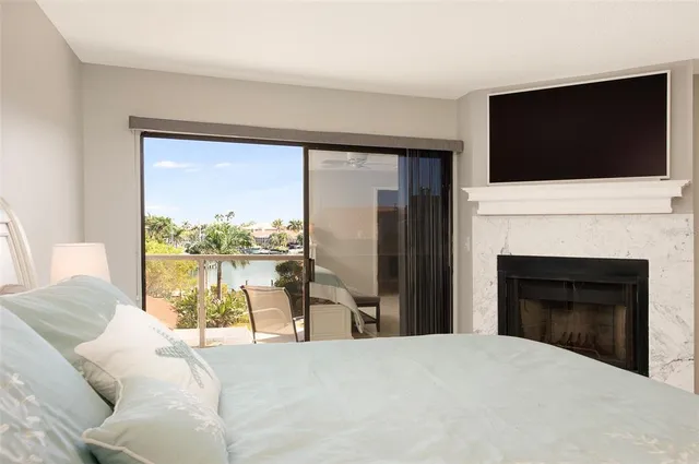 a living room with a flat screen tv and a fireplace