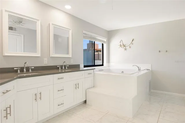 a bathroom with a bathtub and a sink