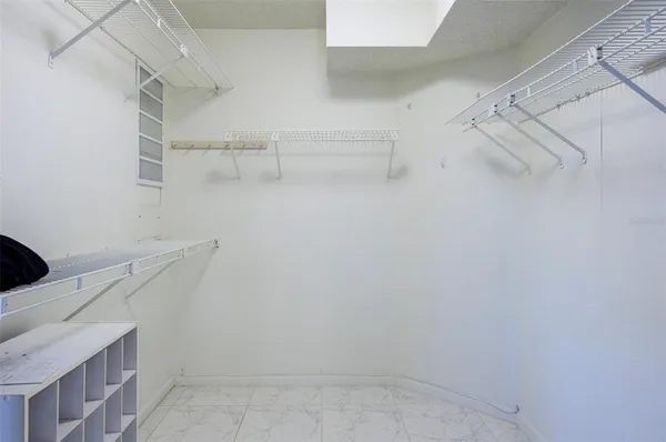 a view of storage and utility room with racks on the wall