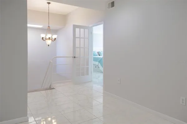 a bedroom with a bed and a night stand
