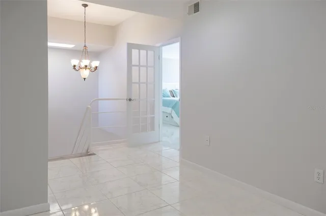 a bedroom with a bed and a night stand