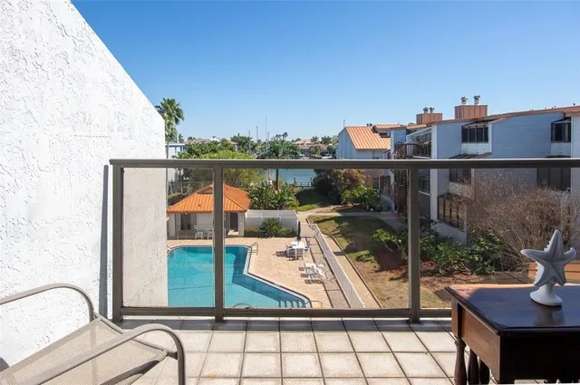 a view of balcony with furniture