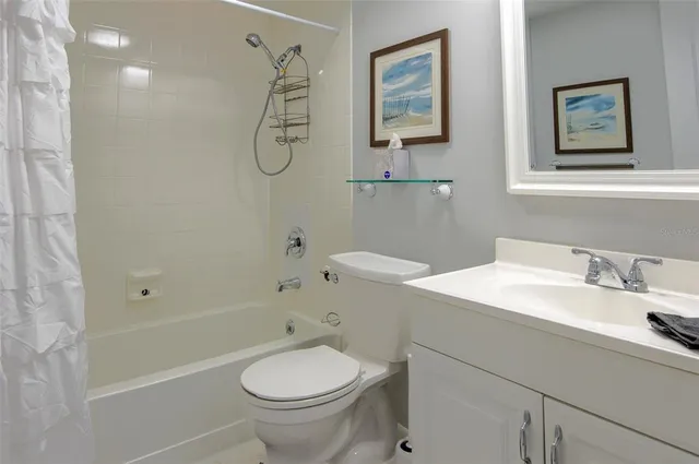 a kitchen with a refrigerator and cabinets
