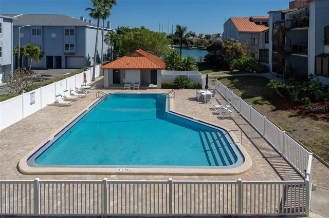 a view of pool with outdoor seating