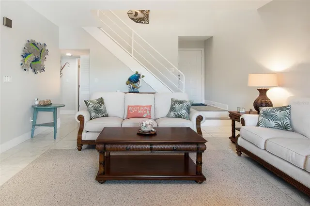 a living room with furniture and a lamp