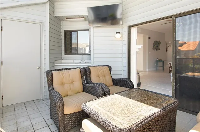 a living room with furniture and a rug