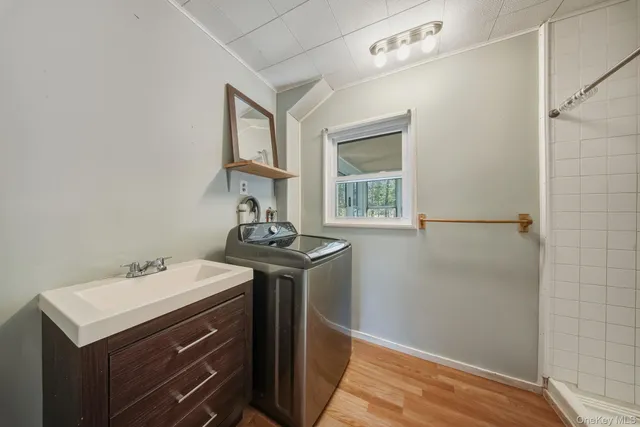 a bathroom with a sink a vanity and a toilet