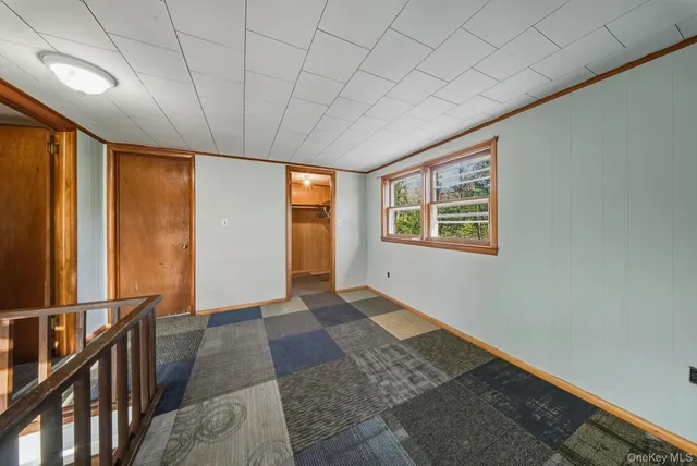 a view of hallway with windows