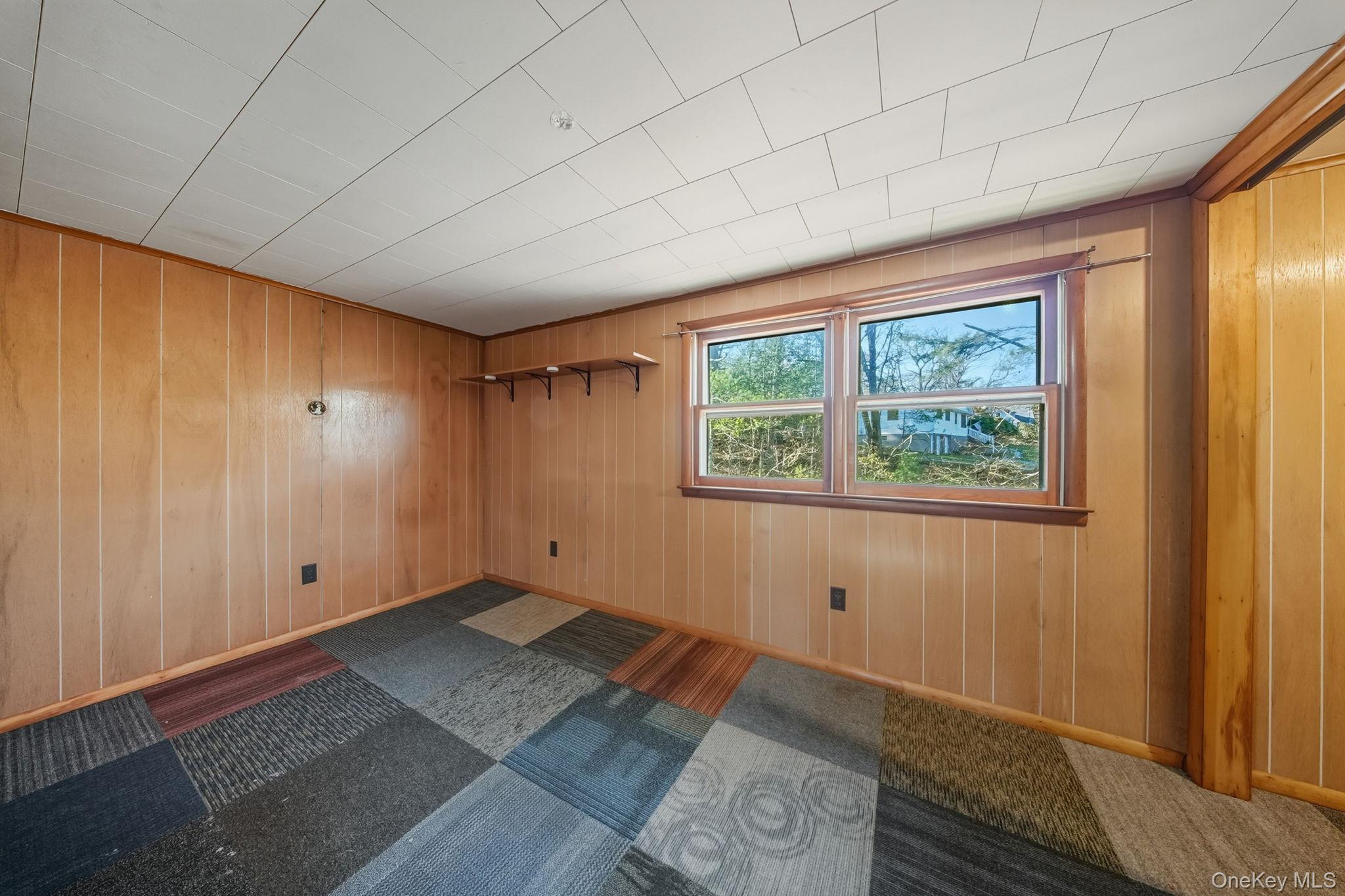 140 Highland Lake Road Highland Lake, NY 12743 - Photo 26 of 34 Unfurnished room featuring wooden walls