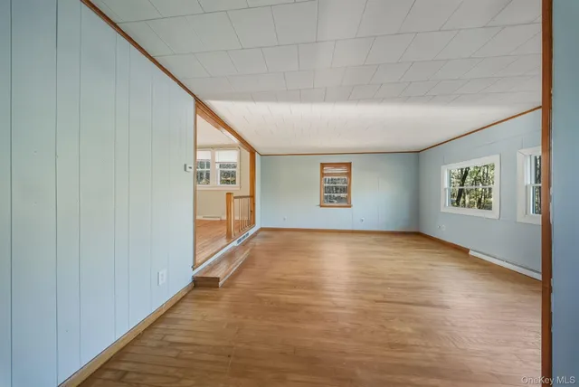 a view of an empty room and a window