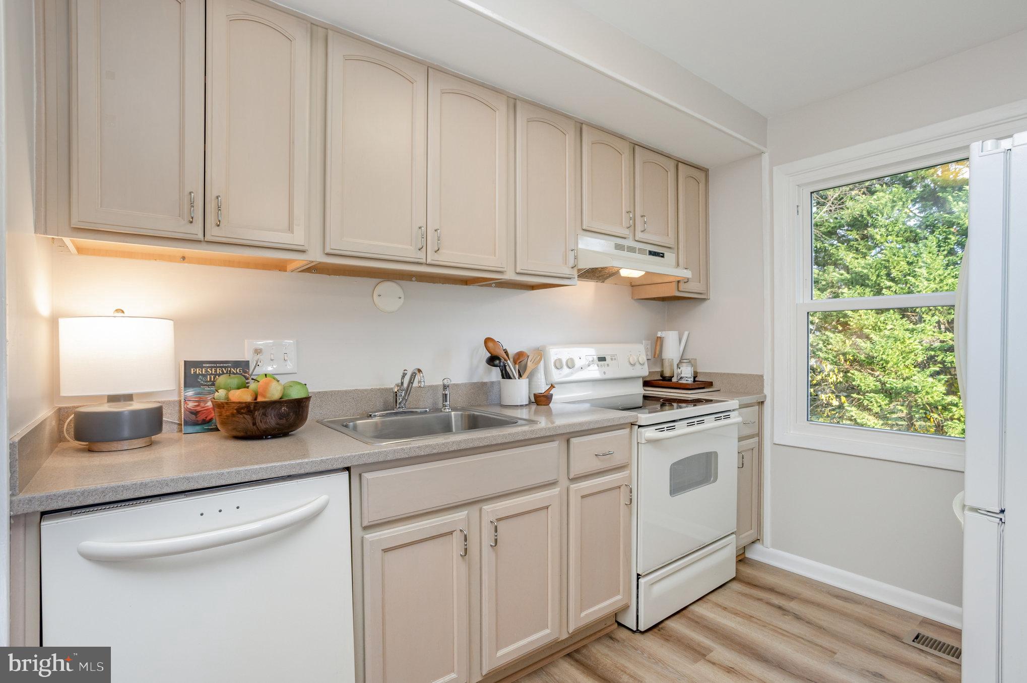 10509 Longbranch Road Cockeysville, MD 21030 - Photo 11 of 38 a kitchen with stainless steel appliances granite countertop white cabinets a sink and dishwasher