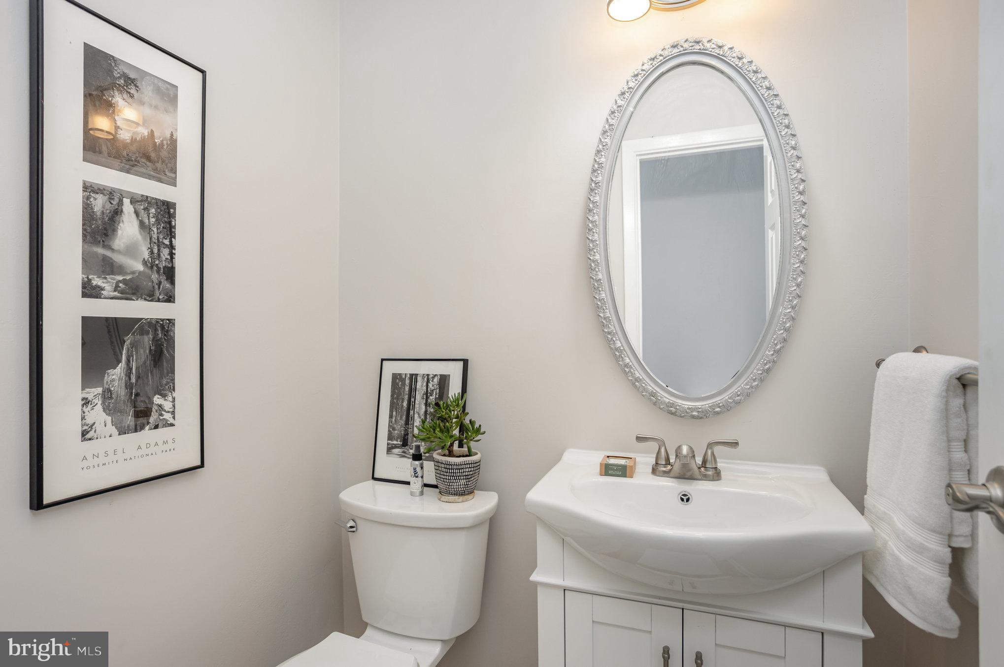 10509 Longbranch Road Cockeysville, MD 21030 - Photo 13 of 38 a bathroom with a toilet a sink and a mirror