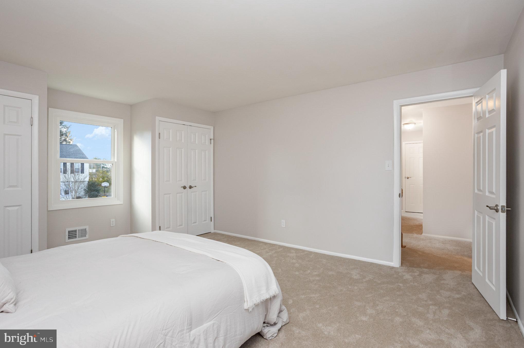 10509 Longbranch Road Cockeysville, MD 21030 - Photo 18 of 38 a bedroom with a bed and a window