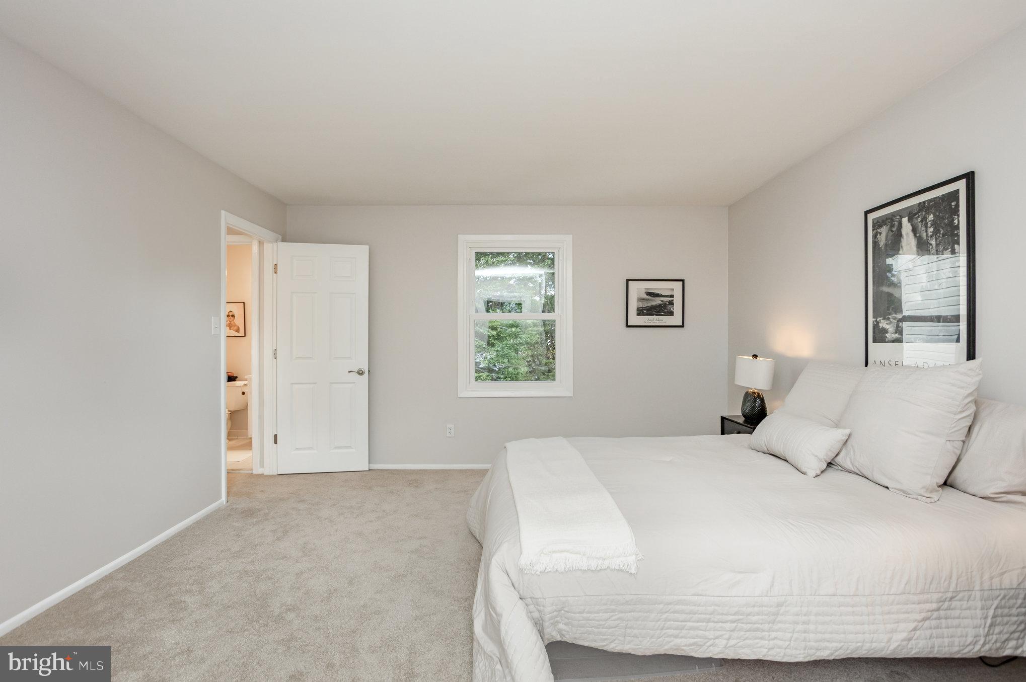 10509 Longbranch Road Cockeysville, MD 21030 - Photo 19 of 38 a bedroom with a bed and a window