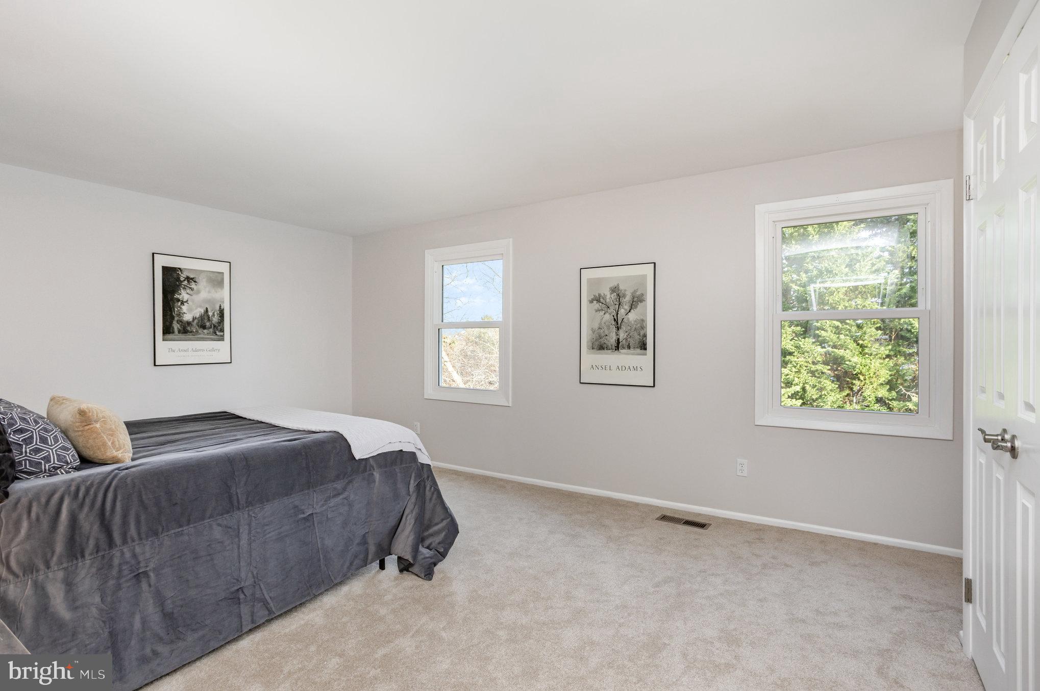 10509 Longbranch Road Cockeysville, MD 21030 - Photo 25 of 38 a spacious bedroom with a bed and a window