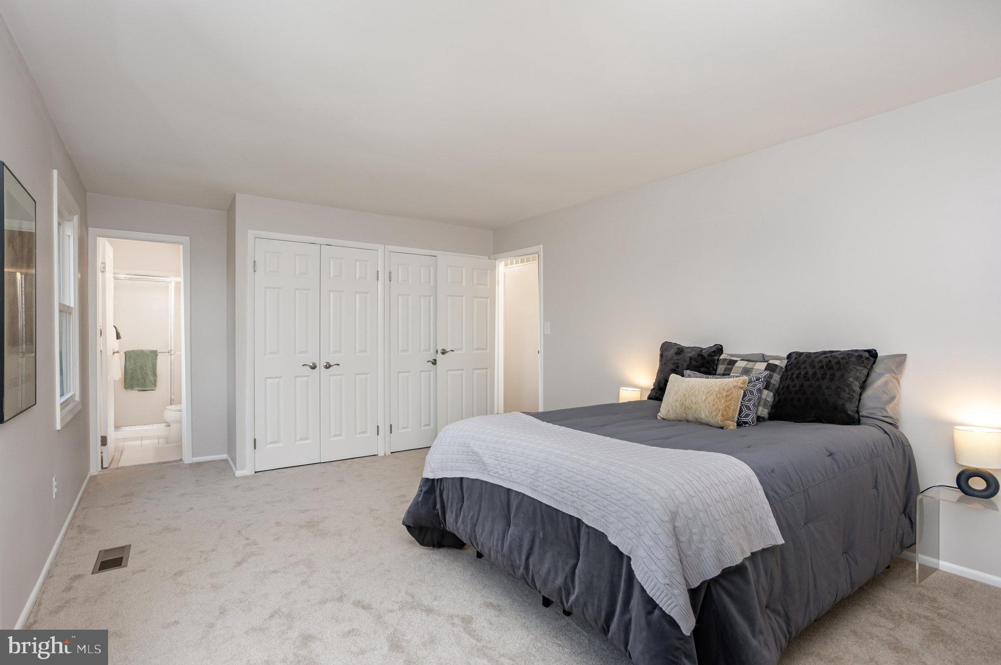 10509 Longbranch Road Cockeysville, MD 21030 - Photo 26 of 38 a spacious bedroom with a bed and a window