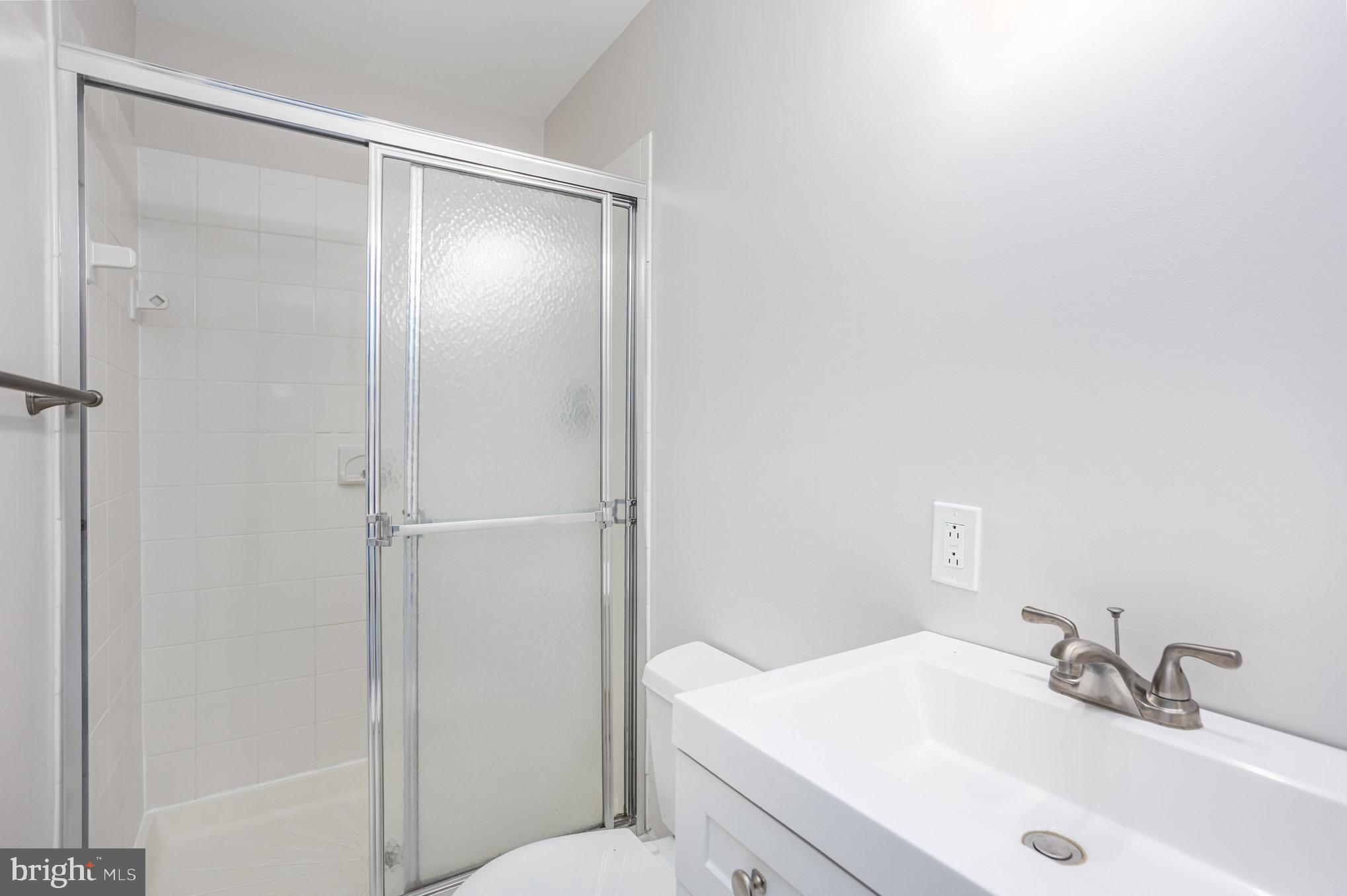10509 Longbranch Road Cockeysville, MD 21030 - Photo 27 of 38 a bathroom with a sink and a mirror
